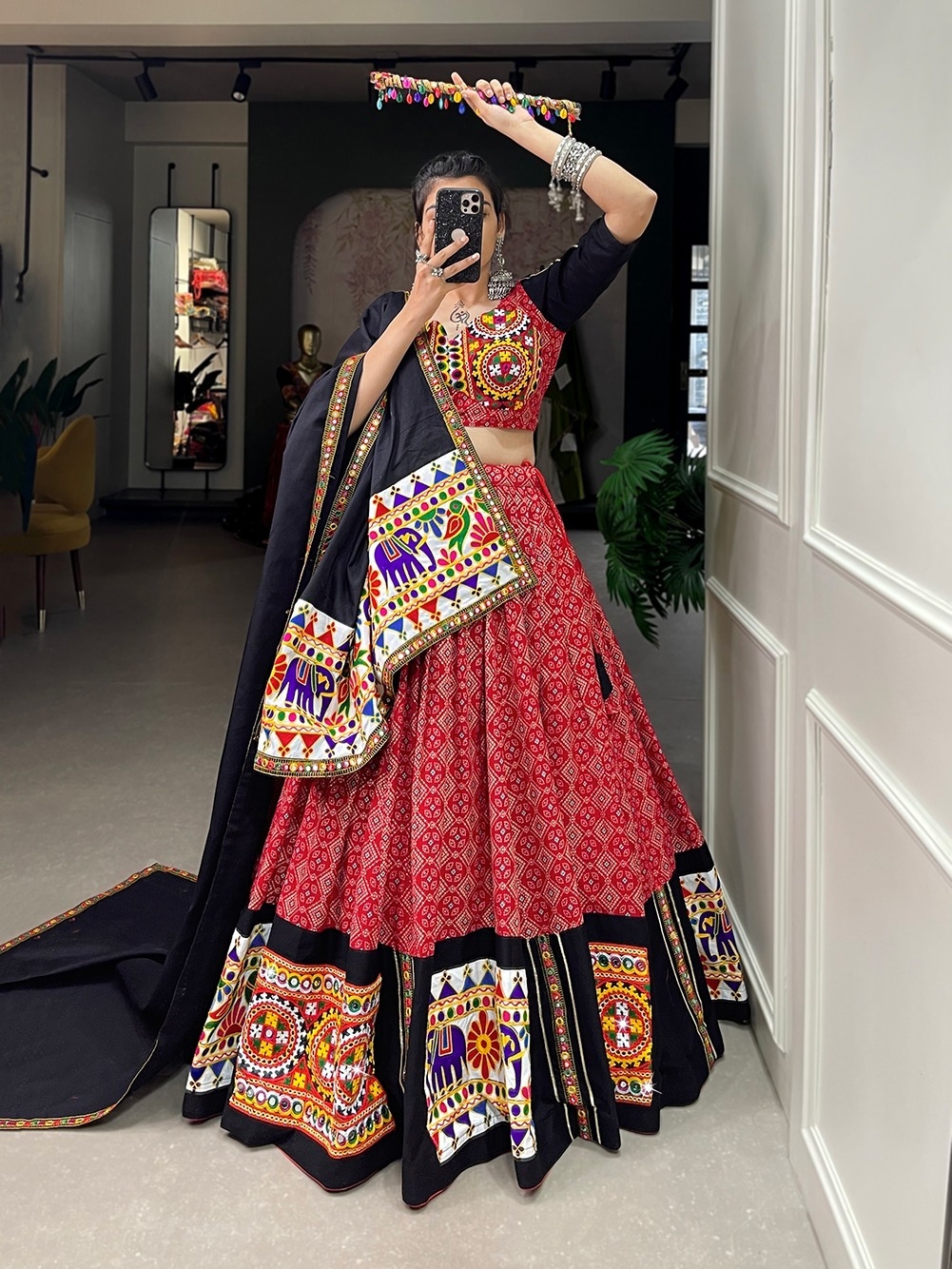 Wear this beautiful masterpiece of garba choli embellishes with gamthi work and mirror work touch up to make everyone feel the stories of navratri traditions